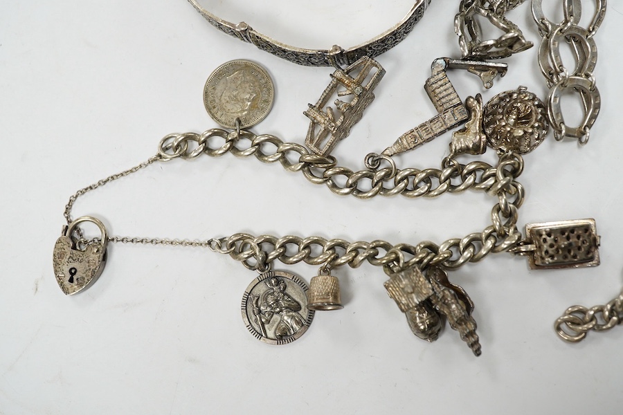 Two silver bracelets, a silver watch chain, a silver and marcasite bracelet and a similar watch. Condition - fair